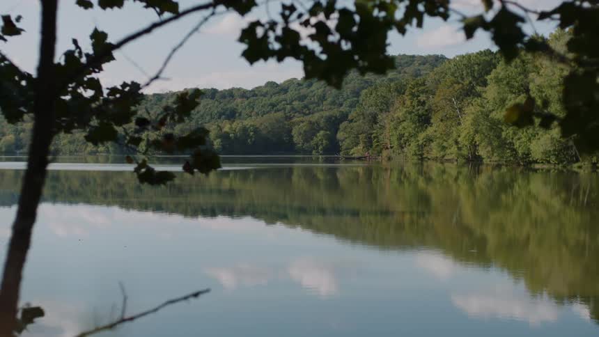 Lake surrounded by hills and trees