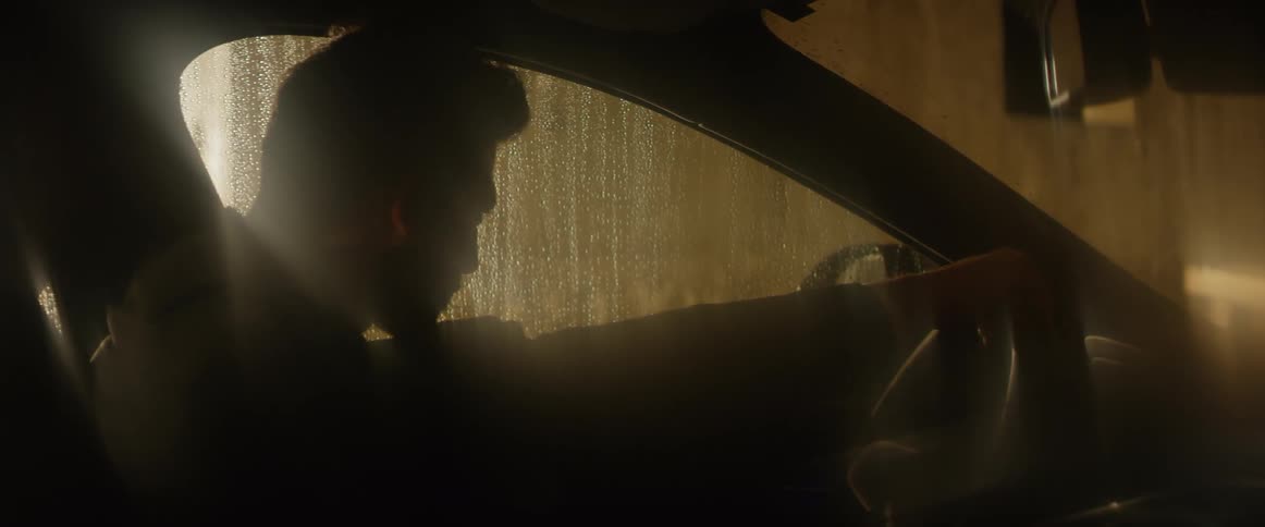A man sits in a car