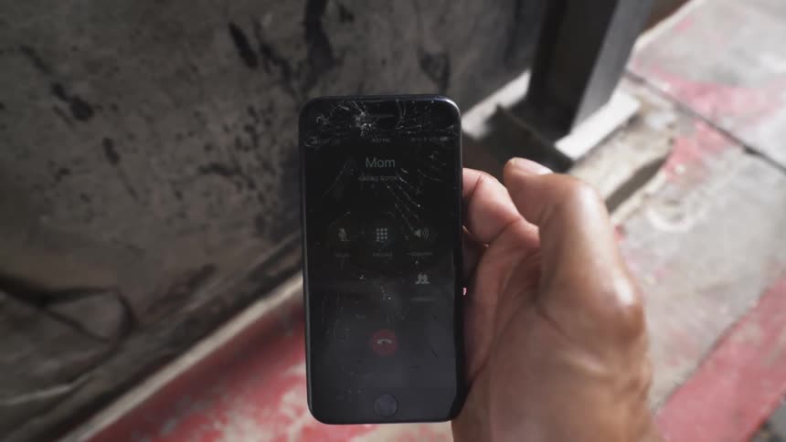 A person holding a smartphone calls their mom