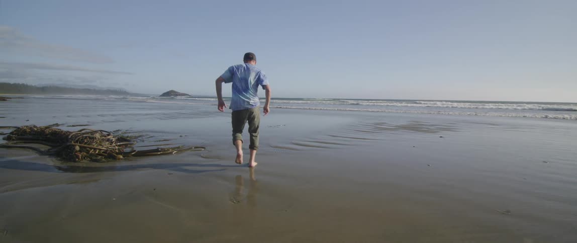 A person running on the beach