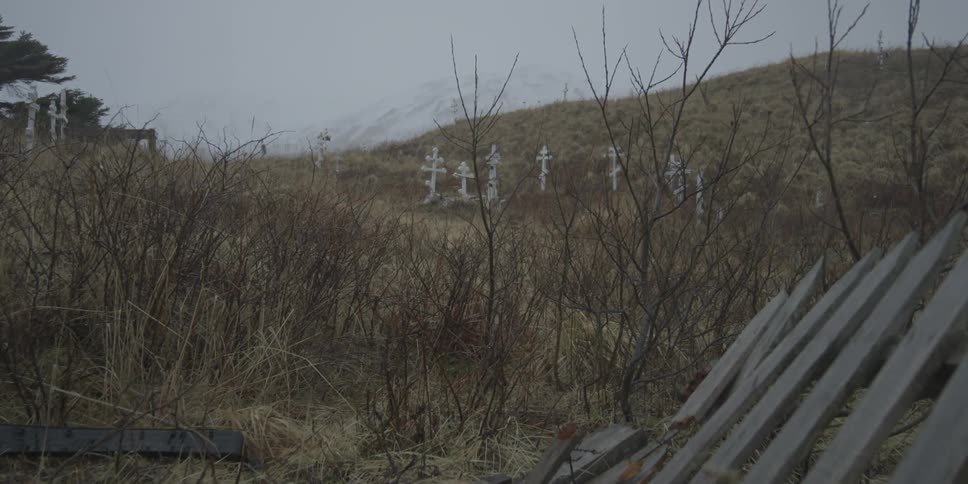 Crosses sit on a rural hill