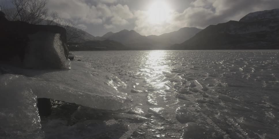 Sun is reflecting off a frozen lake