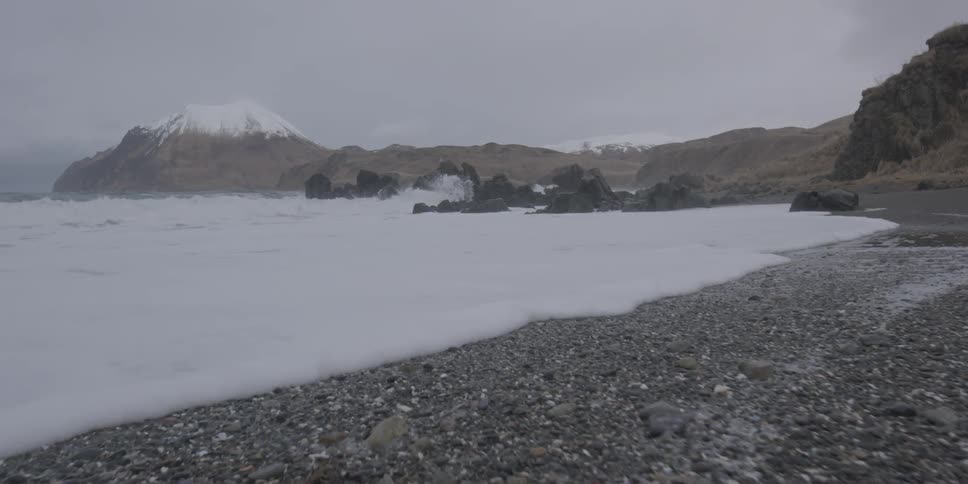 Waves roll onto a rocky shore