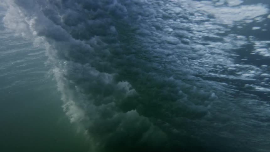 The waves shoot water below the surface