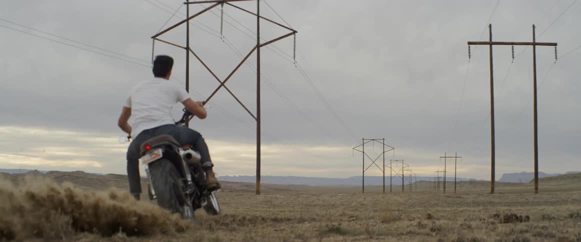 A person peels off on a motorcycle