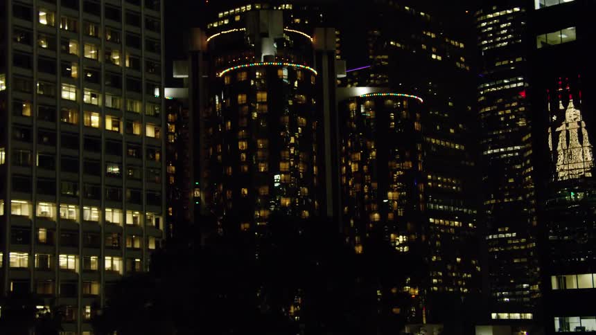Traveling through the city at night filming the skyscrapers