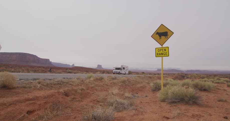 Motorhome parked on the side of a desolate highway