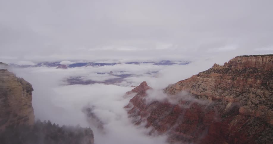 Clouds hover over mountains
