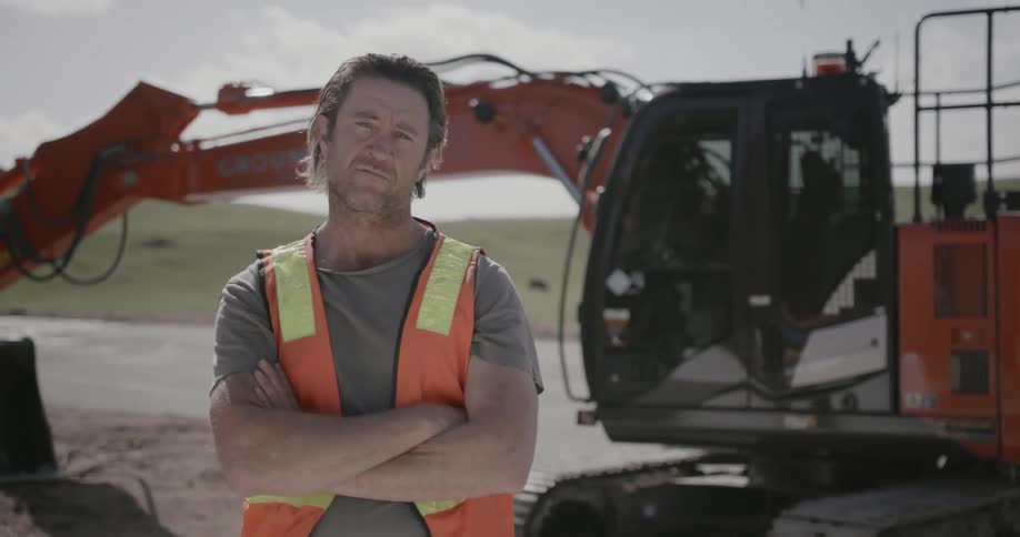 A construction worker stands on site