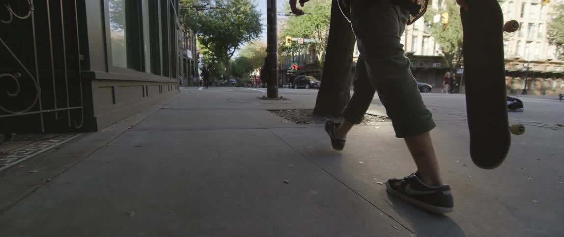 A person walking on a sidewalk