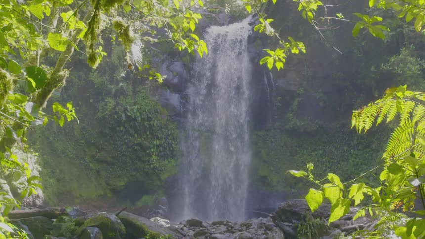 Water falling from a waterfall on the side of a cliff