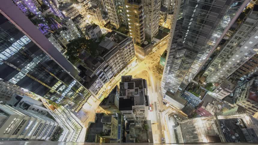 Vehicles bustle along city roads at night