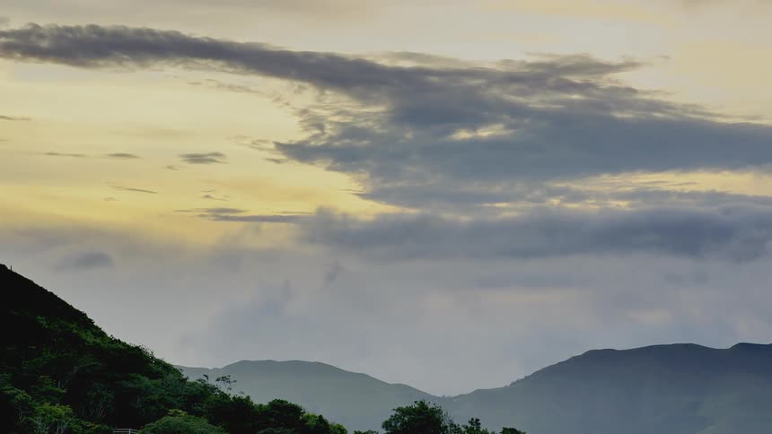Clouds passing above mountains