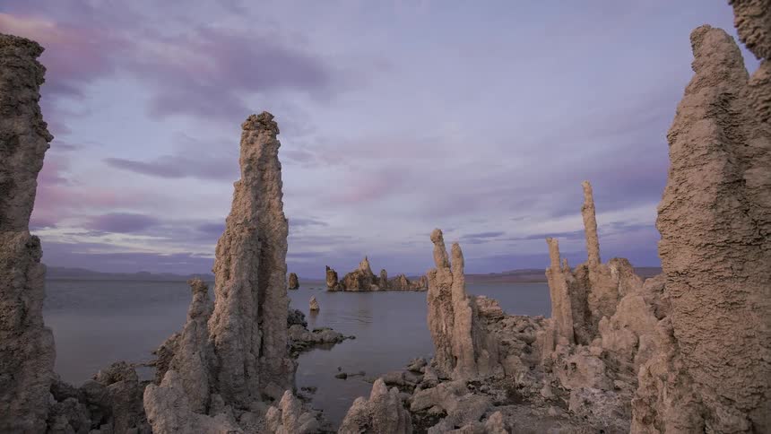 Clouds are drifting over mono lake at dusk