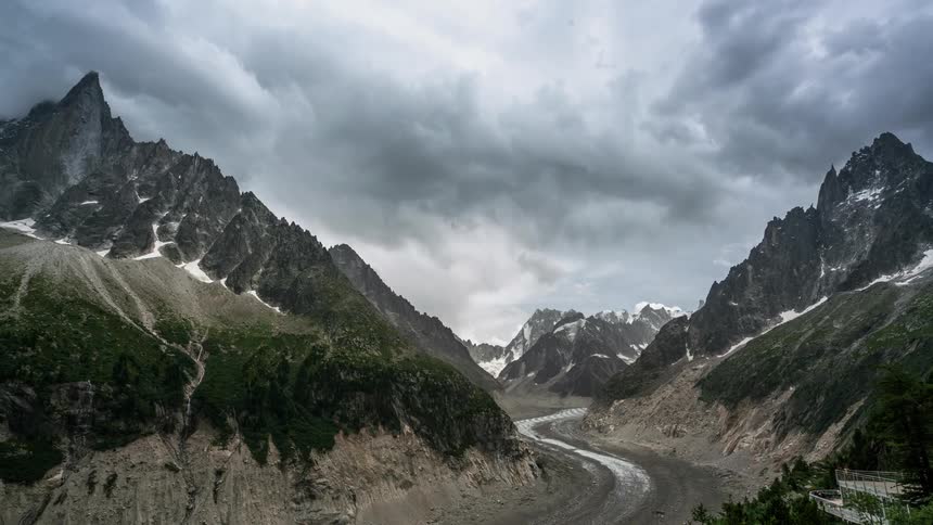 Clouds pass over mountain peaks