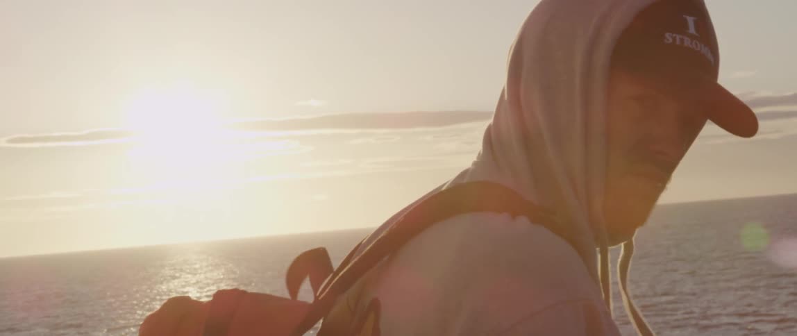 Man wearing a hoodie on the water