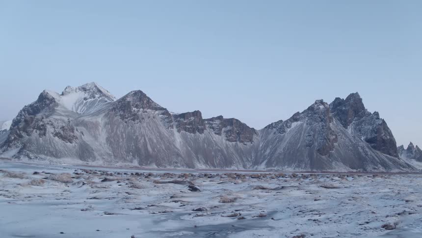 The icy field leads to a mountain