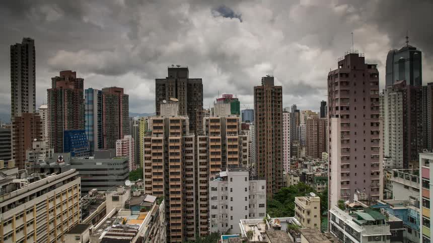 Clouds move over the skyscrapers in a city