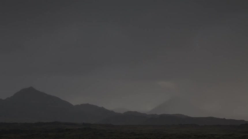 Clouds pass above the desert