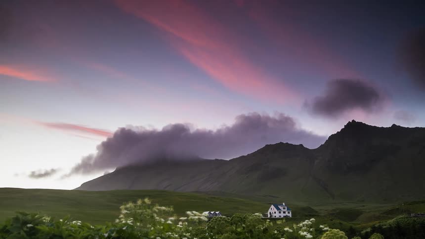 Time lapse of clouds forming over a hillside