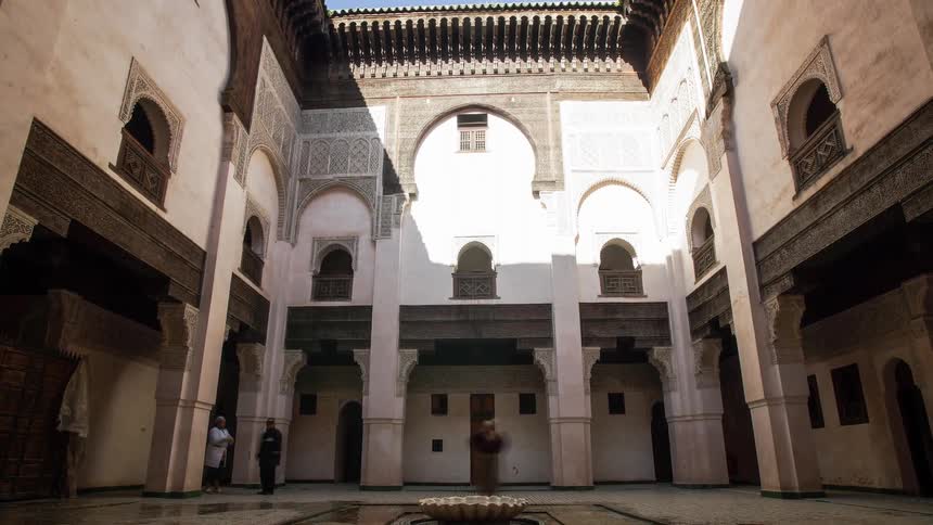 Time lapse of people visiting inside of a mosque courtyard