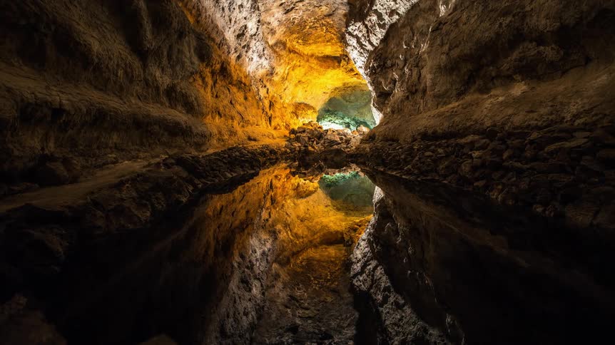 The cave is dark and full of water