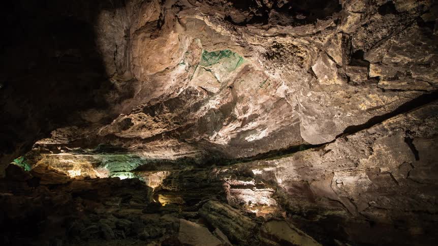 Lights are shining inside a cavern