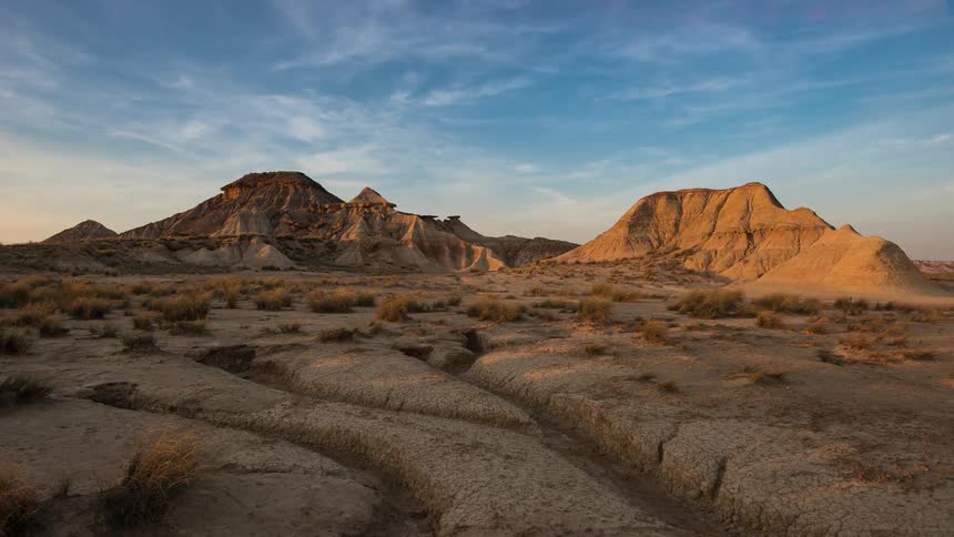 Clouds pass by above in the desert