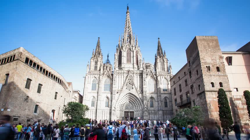 A busy city street and people visiting an old church
