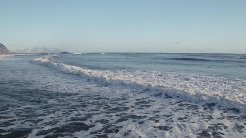 Ocean waves flow towards the coast