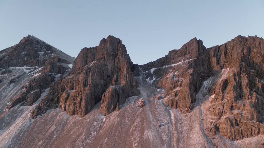 A rocky cliff side drops down