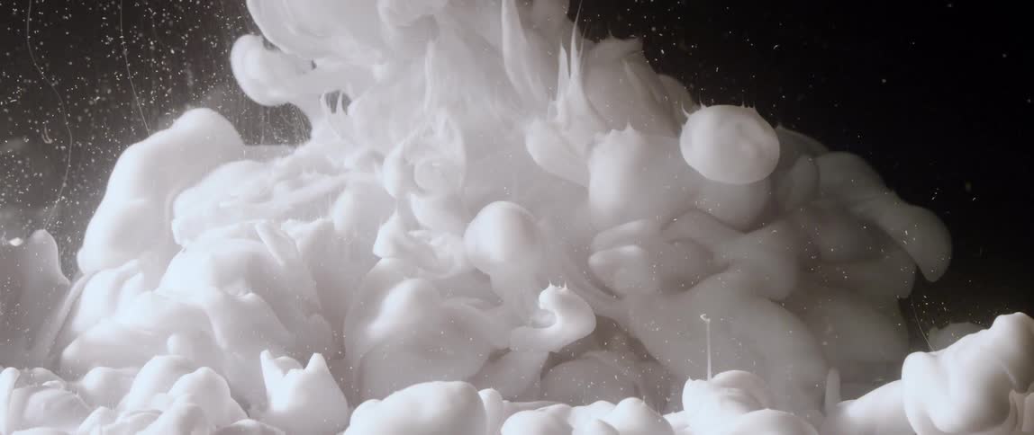 Fluffy white smoke clouds are shown close up