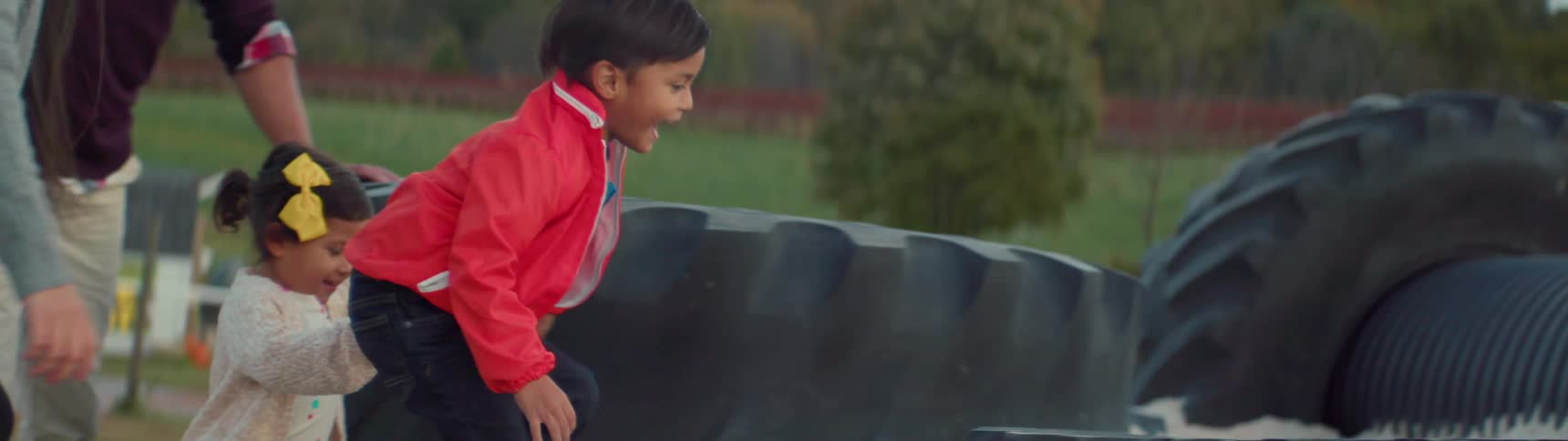Children playing on old tires