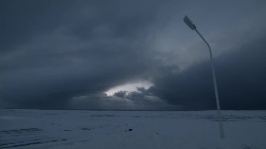 Dark skies above a frozen landscape