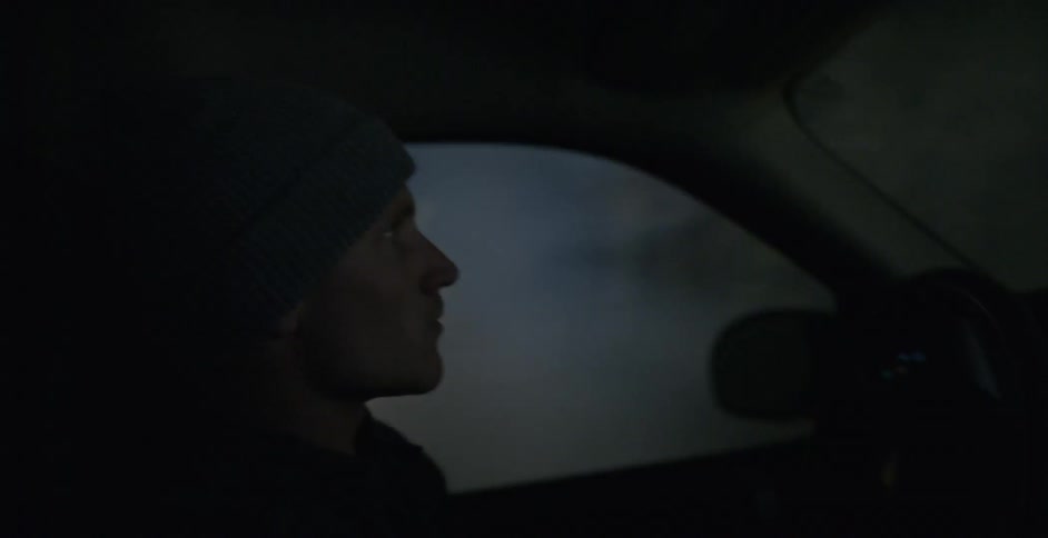 A person driving at night