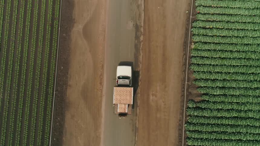 A truck drives on a rural road