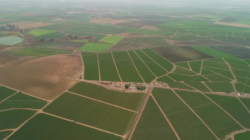 Agricultural fields cover a landscape