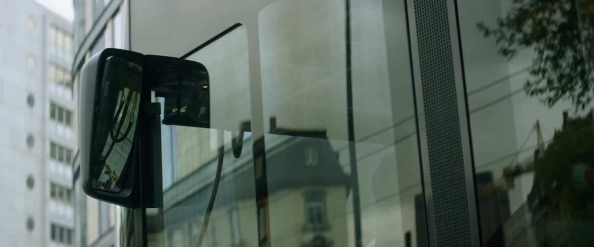 A bus travels on a city street