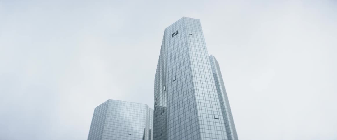 Tall glass skyscrapers tower into the sky