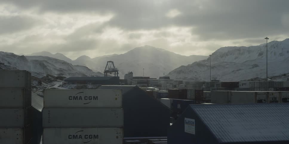 The clouds roll over the port on a snowy day