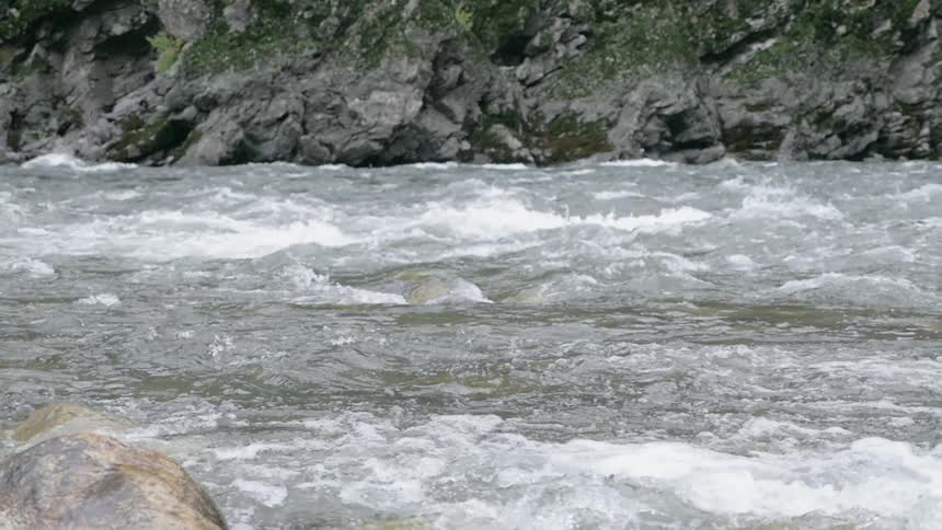 Water flowing in the river turns white in the rapids