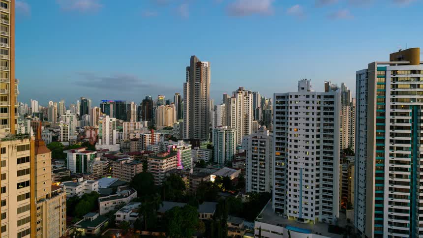 Clouds pass over and night falls on a city