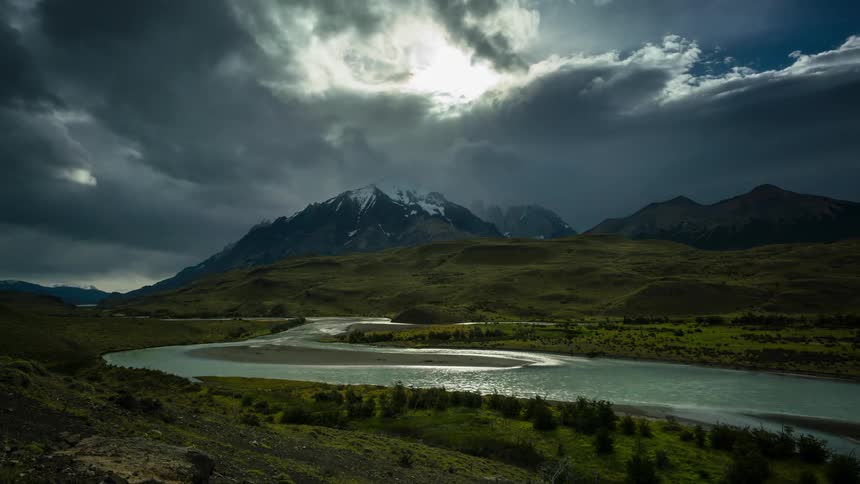 Clouds float over a mountain river