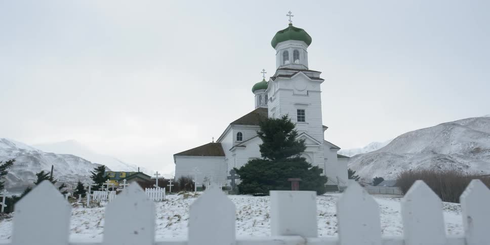 A church sits atop a snowy hill