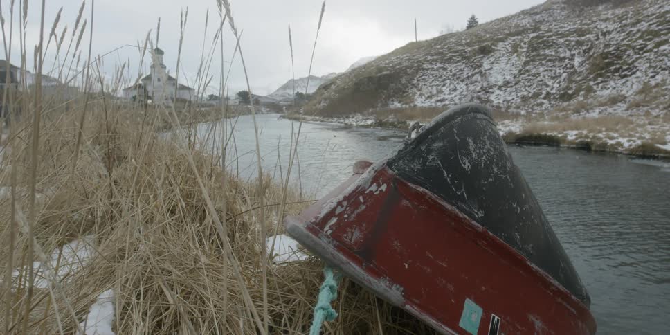 Church steeple beyond a boat
