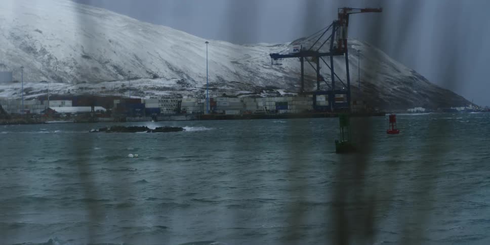 An ocean harbor beneath mountains