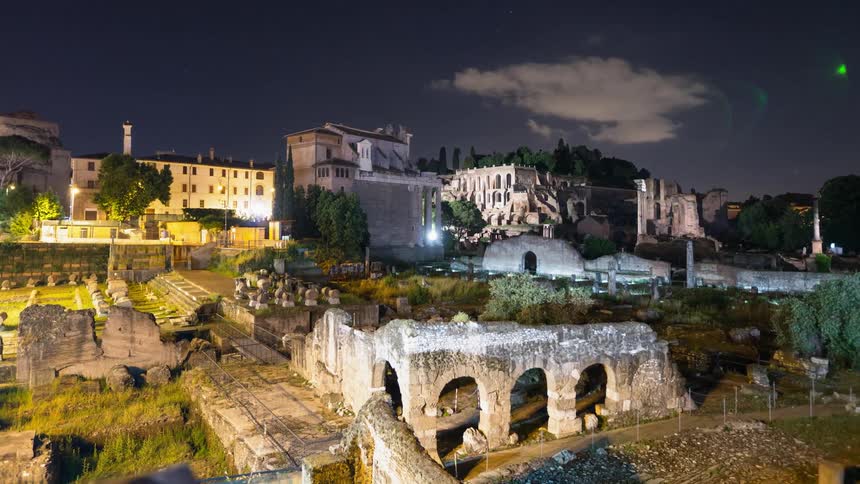 Clouds float over ruins in a city