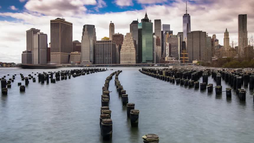 Water flows in front of skyscrapers
