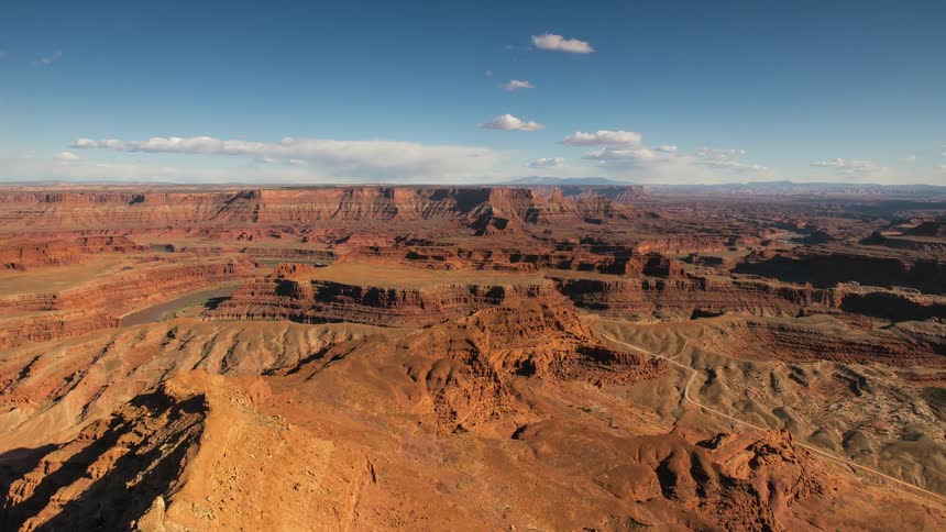 Clouds float over canyons in a desert