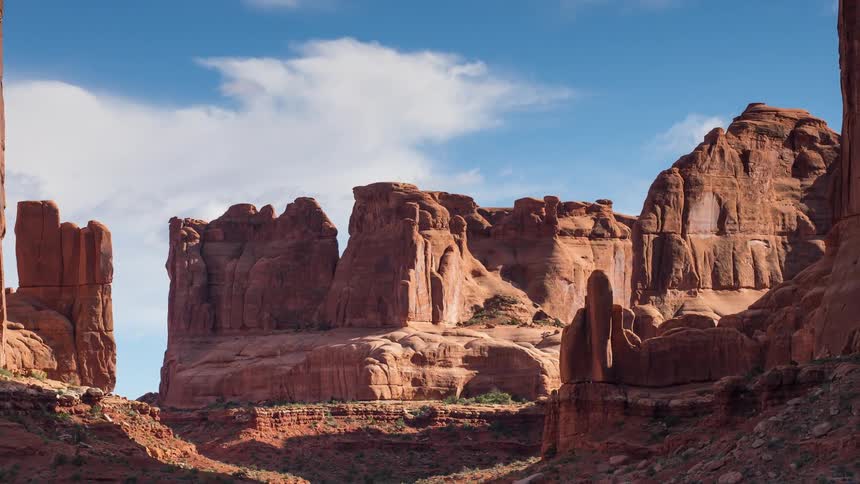 Clouds move over cliffs and rock formations